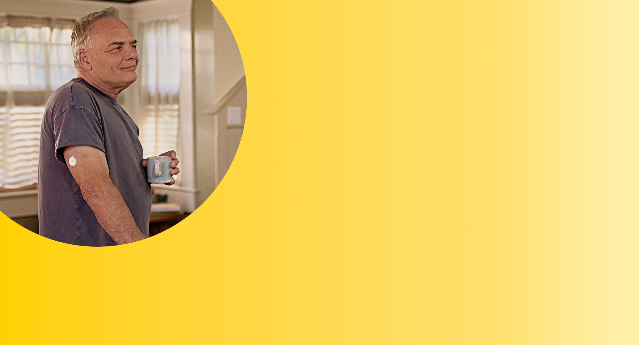 Man wearing FreeStyle Libre 3 Plus sensor in kitchen