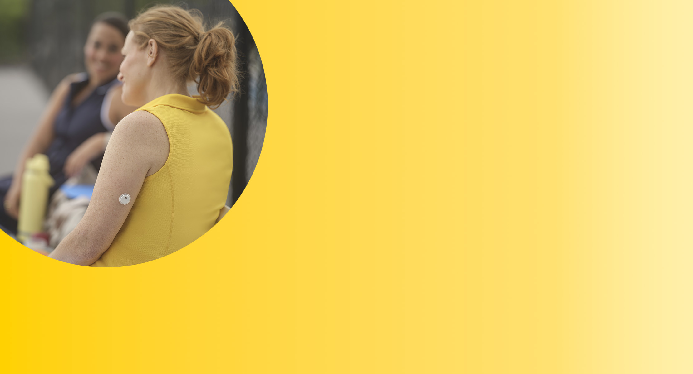 Woman with FreeStyle Libre 2 Plus sensor sitting with friends