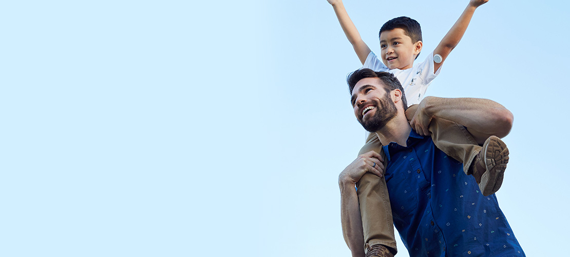 Man holding child on his shoulders