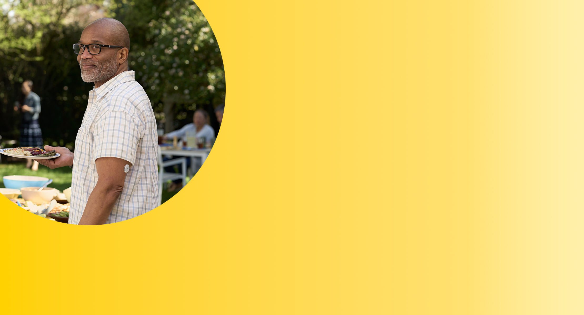 Man at BBQ wearing FreeStyle Libre 2 sensor