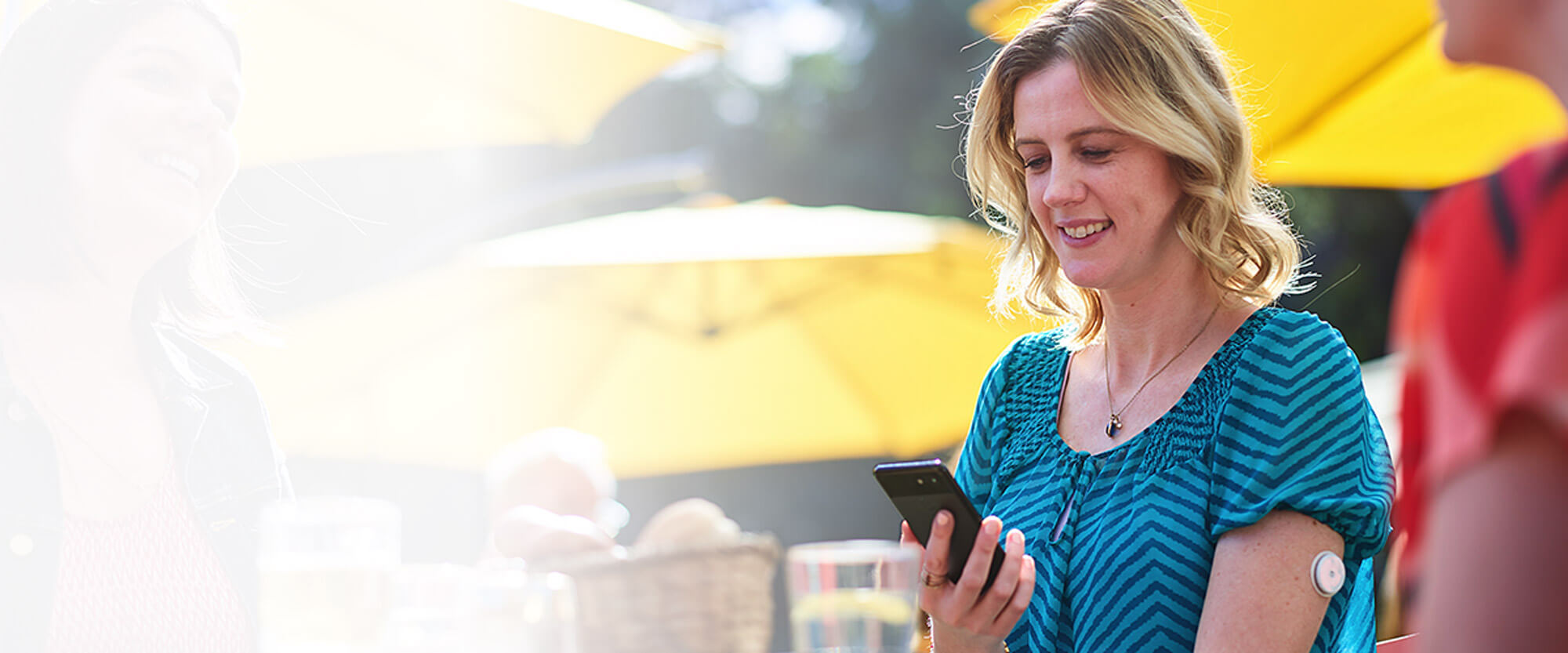 Woman with sensor looking at her phone