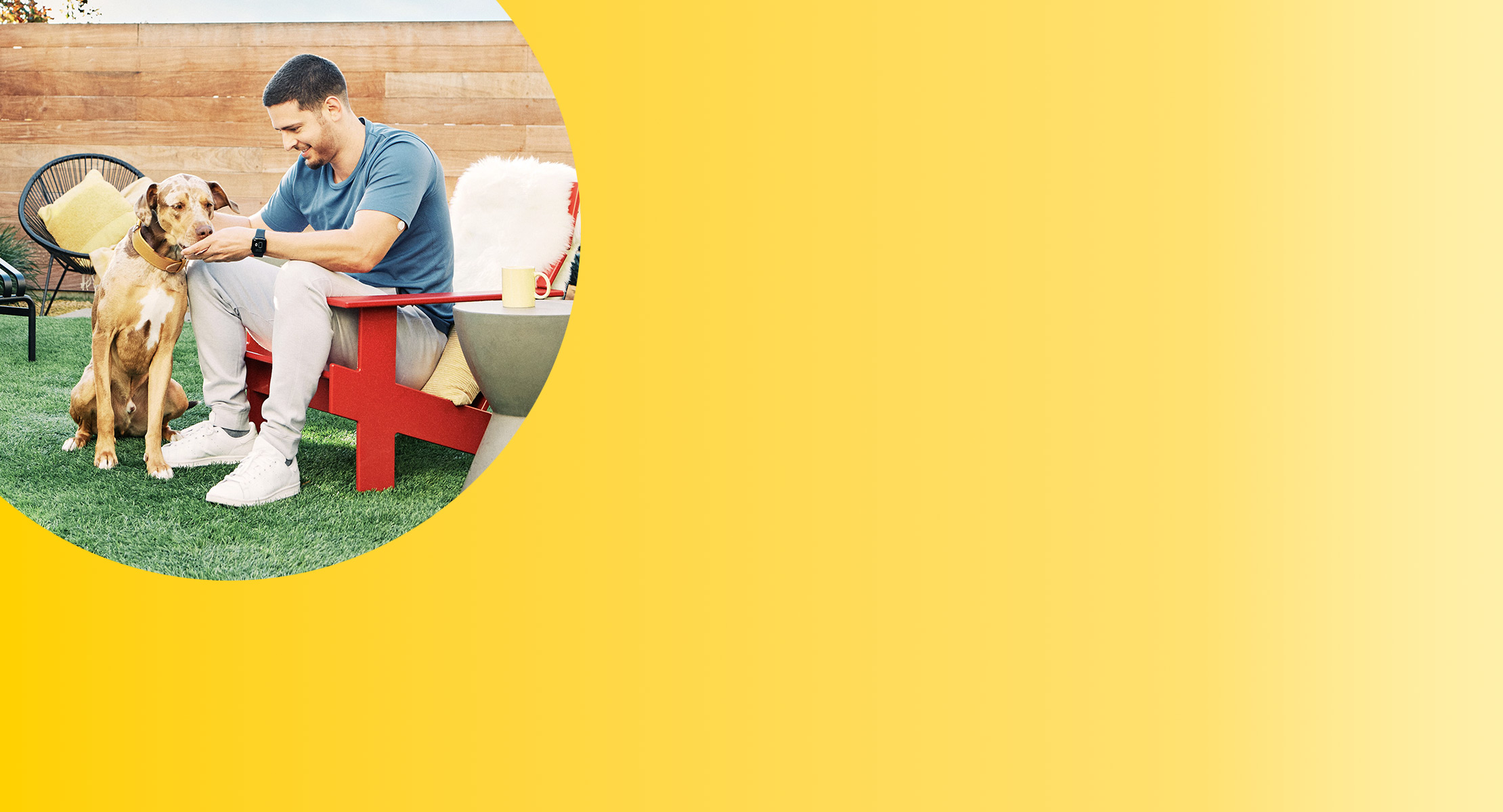 Man with FreeStyle Libre 3 sensor petting his dog