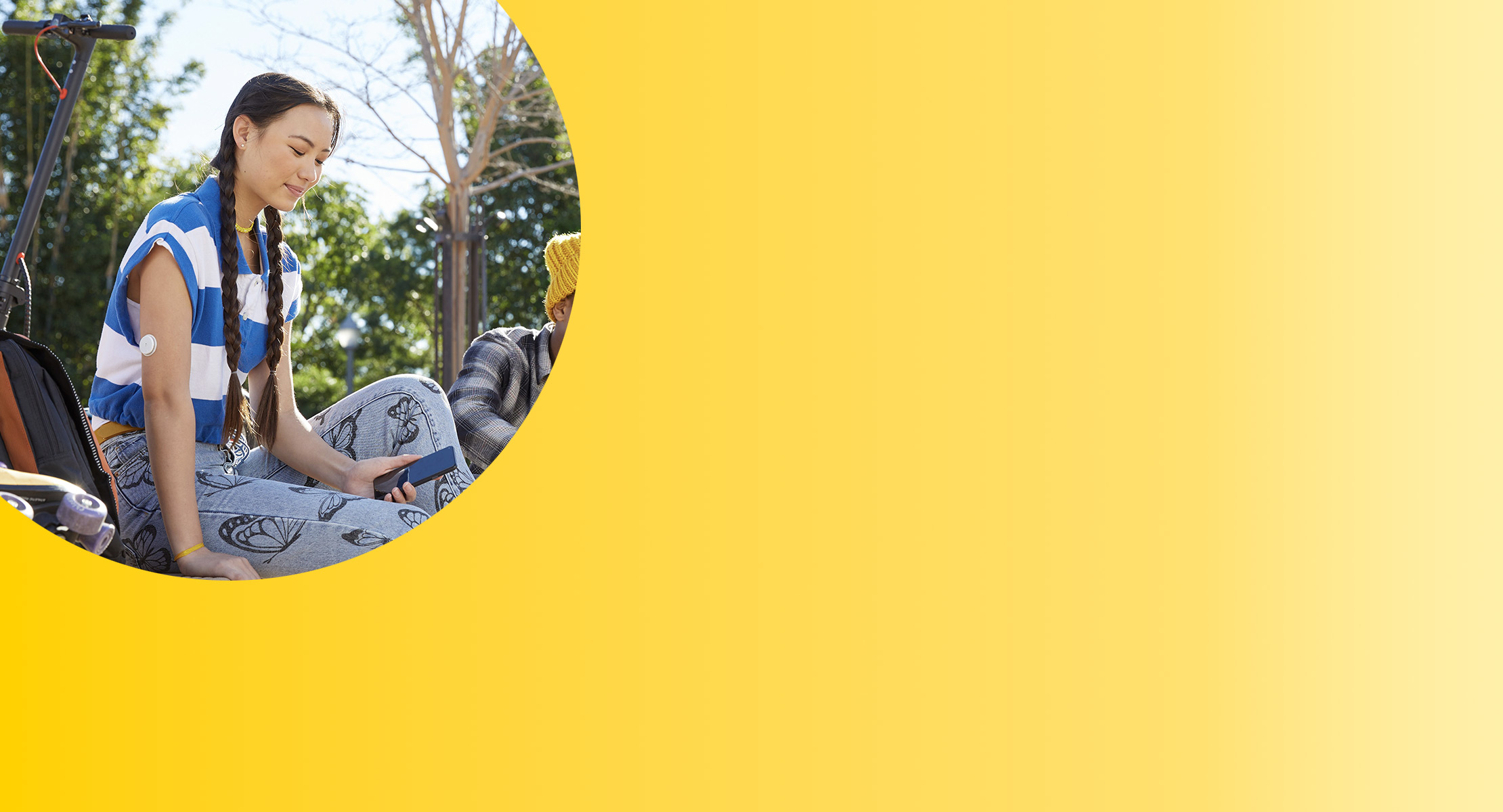 Teen wearing Libre 2 Plus sensor reviewing her data in FreeStyle LibreLink app