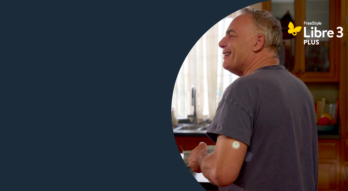 A man wearing a FreeStyle Libre sensor enjoying his morning coffee.