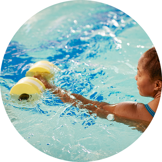 Woman wearing FreeStyle Libre sensor during swimming activity