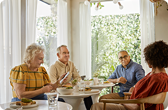 A group of elderlies having lunch together 