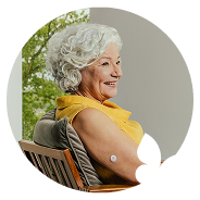 Woman sitting in the lawn chair while wearing a FreeStyle Libre 3 Plus sensor