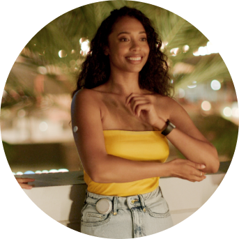 Smiling woman wearing a twiist™ AID System