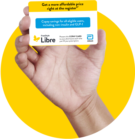 Hand holding the FreeStyle Libre copay card