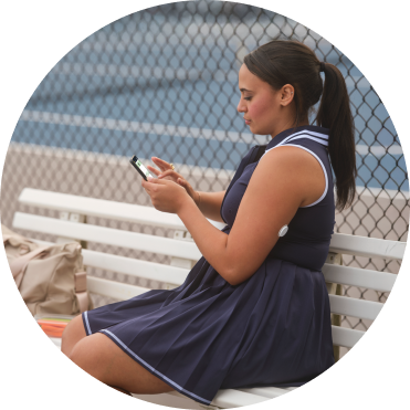 Woman walking in the woods wearing a FreeStyle Libre 2 Plus sensor