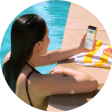 Woman by the pool wearing a FreeStyle Libre 3 Plus sensor
