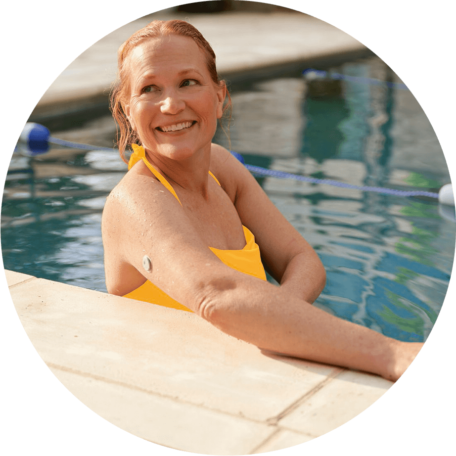 Woman wearing a Libre sensor in a swimming pool