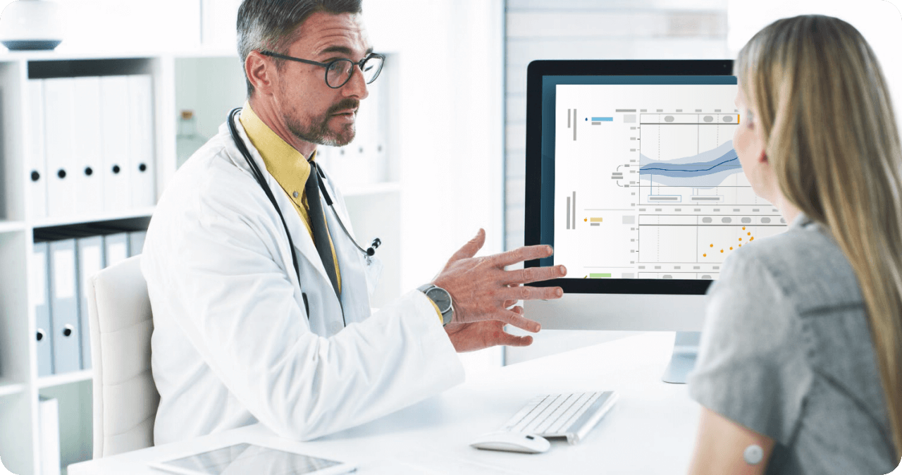 A doctor reviewing LibreView data with a patient