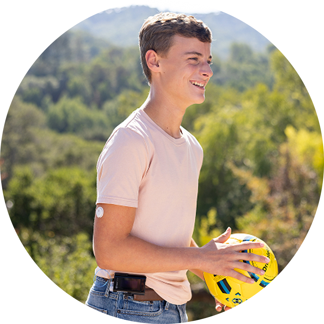 Young adult wearing Ypsomed holding a ball
