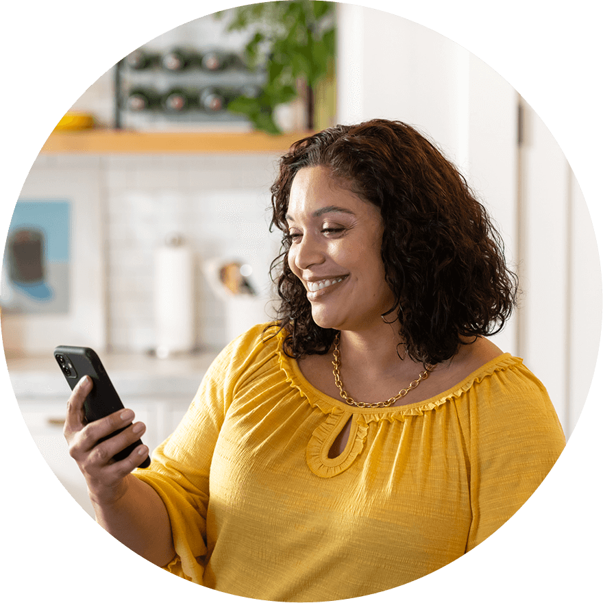 Women looking at her phone and smiling