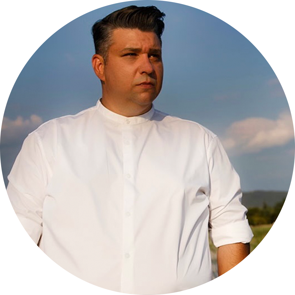 A man in front of a blue sky