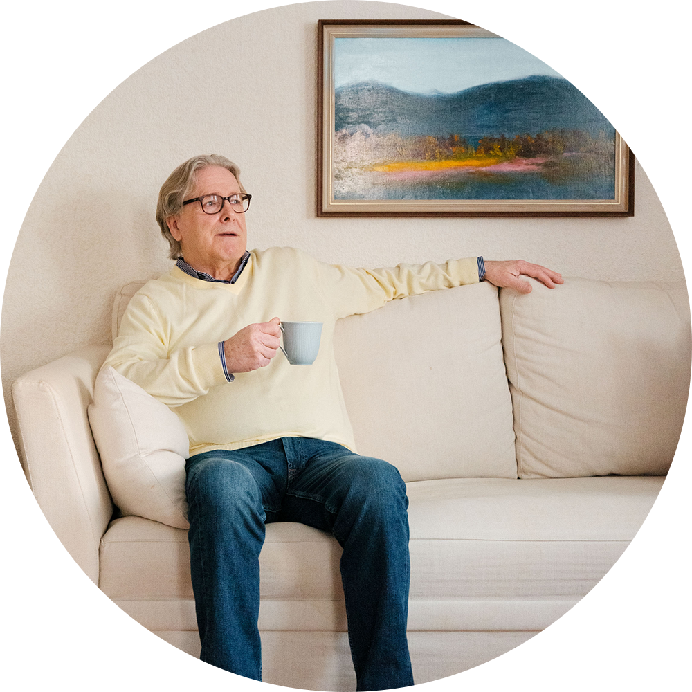 A man in front of a blue sky