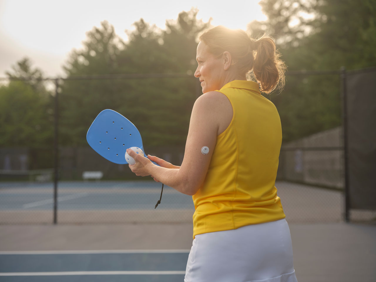 Woman swimming with sensor