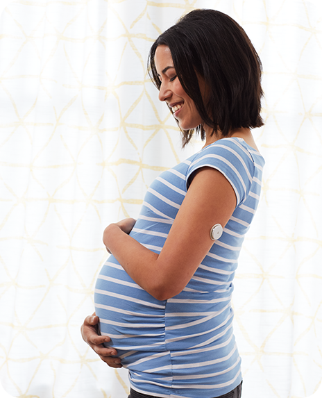 Pregnant woman scanning FreeStyle Libre sensor