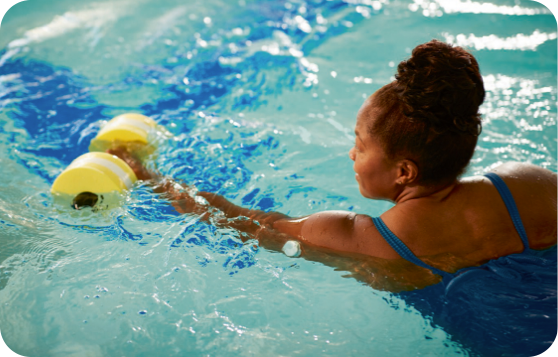 Woman swimming wearing a FreeStyle Libre sensor