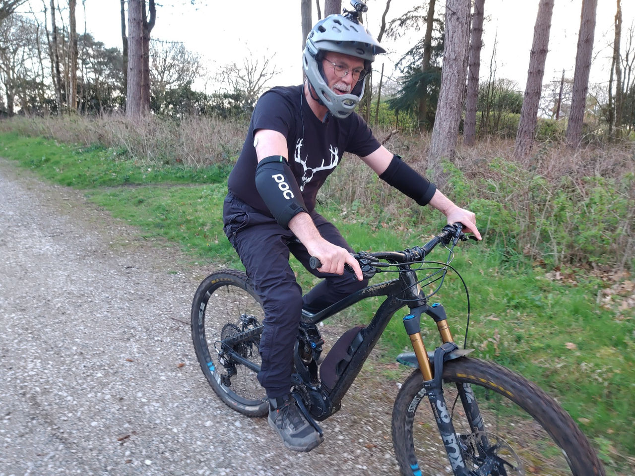 Mike, blog author, riding his bicycle wearing a safety helmet