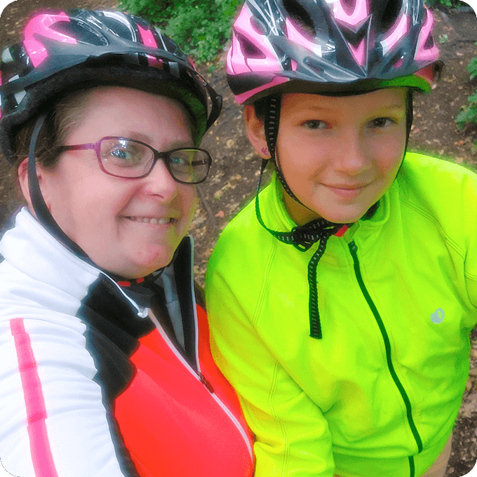 Tracy, blog author, posing next to her daughter where both are smiling and wearing safety helmets