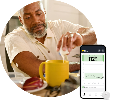 Patient with FreeStyle Libre systems sensor and Libre app for smartwatch and smartphone